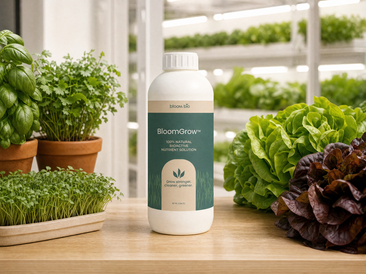 BloomGrow 1 L bottle with microgreens, potted basil and herbs, and green and red butterhead lettuce in front of vertical grow racks